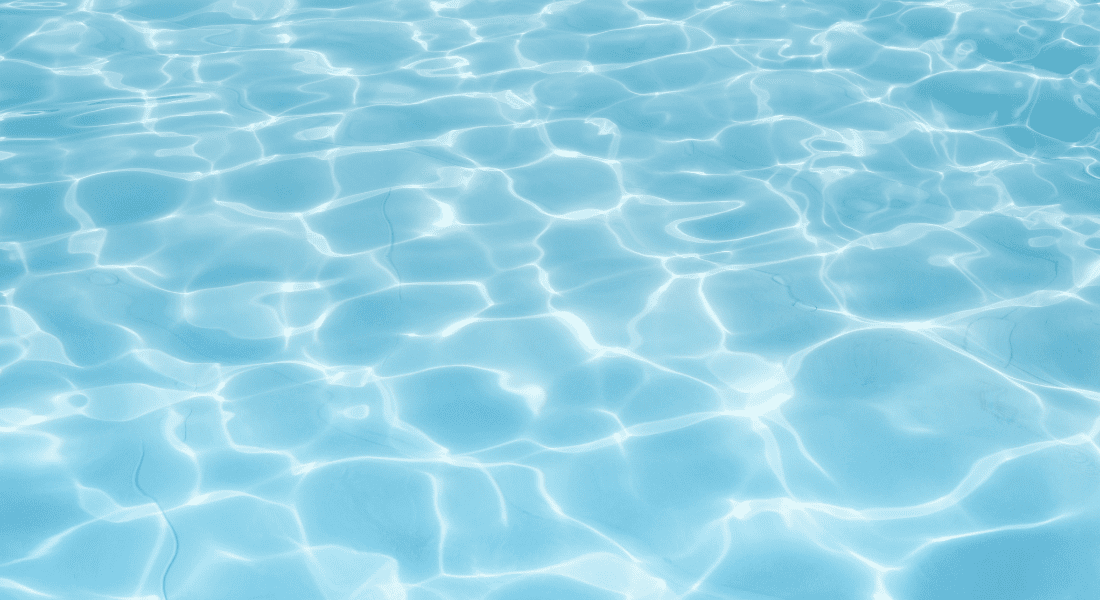 A pool with blue bottom with crystal clear water